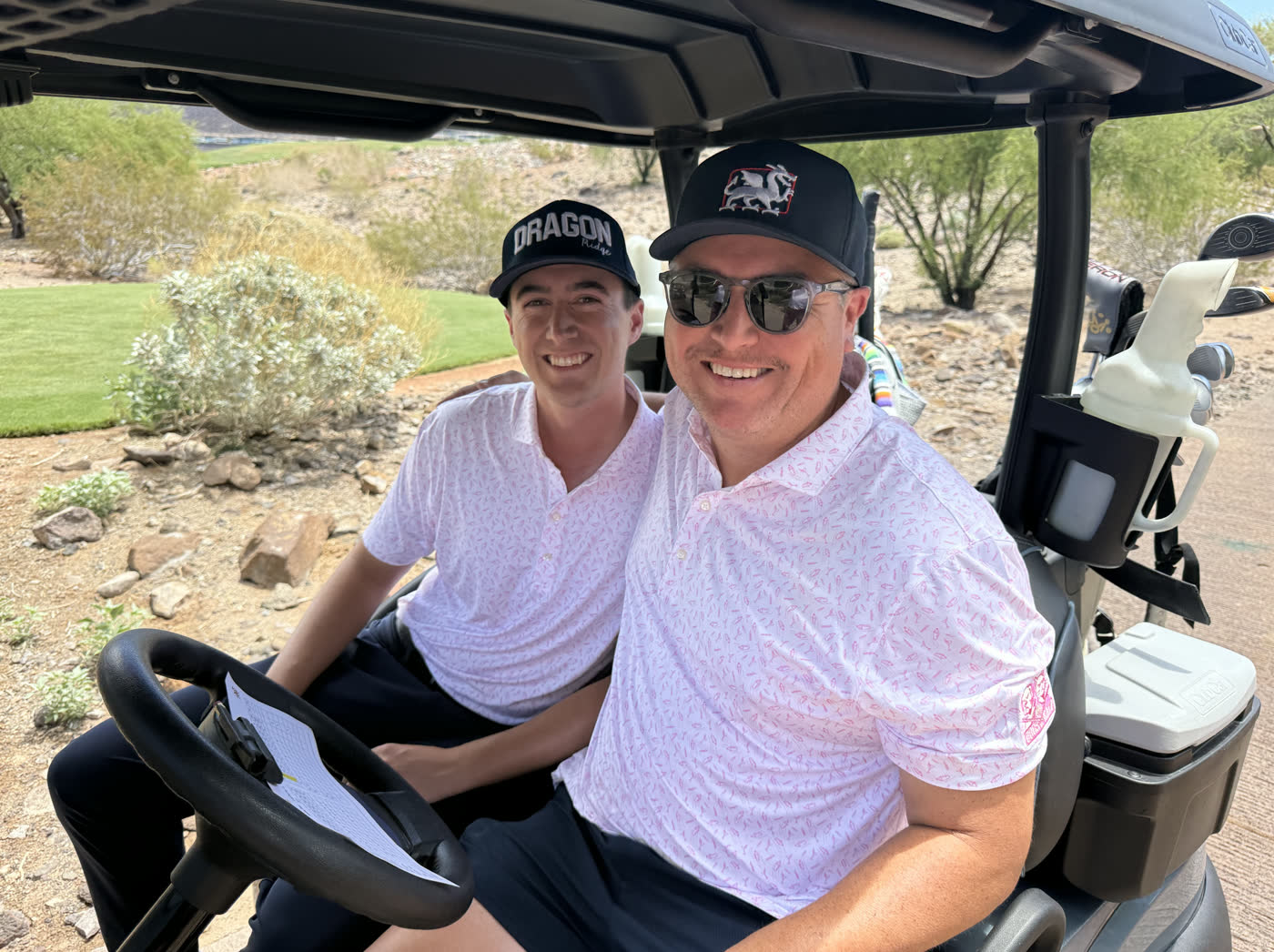 Two golfers in a cart