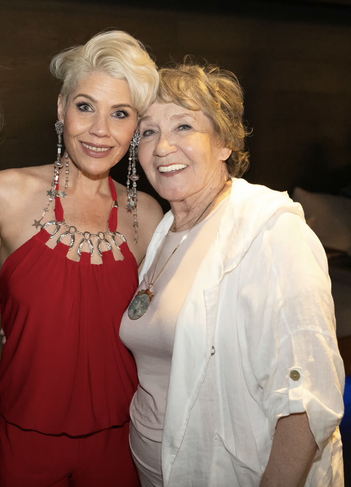 Guests smiling at an evening event