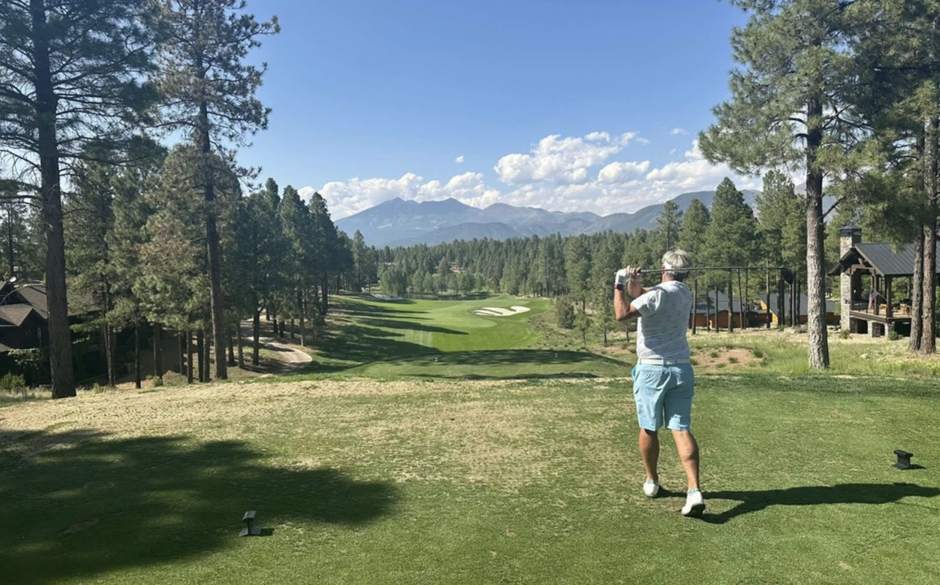 Mountain golf course under big skies