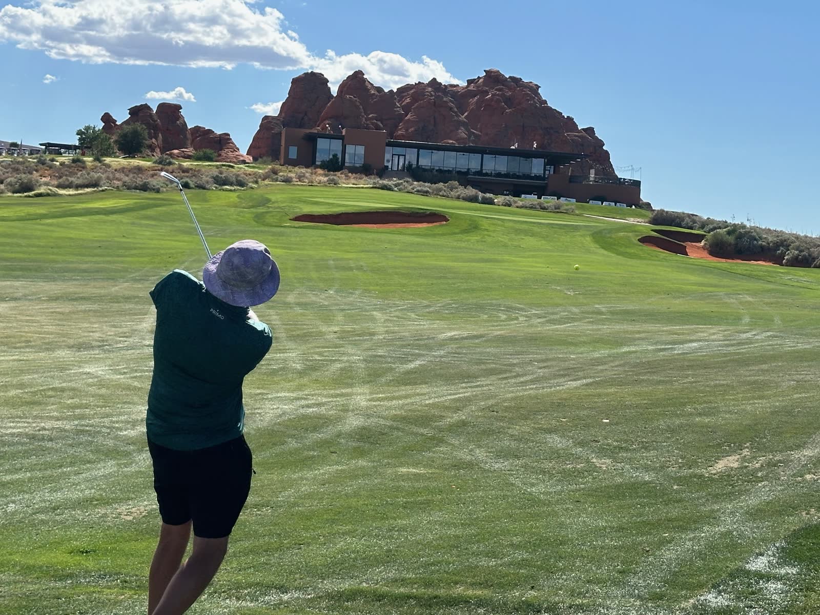 Approach shot to the 18th green below the red-rock clubhouse at Sand Hollow