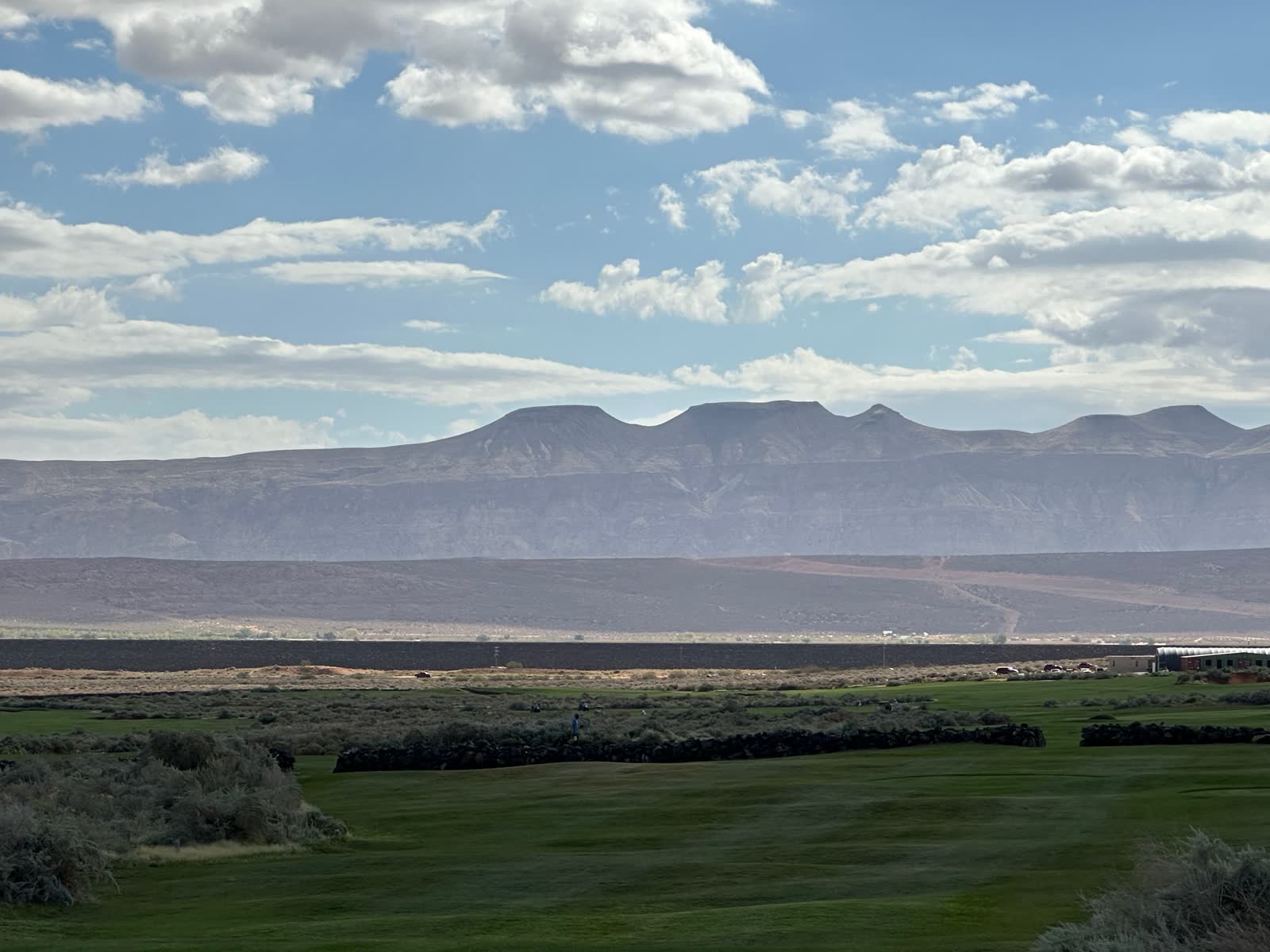 Flat-topped mesas beyond the course near St. George